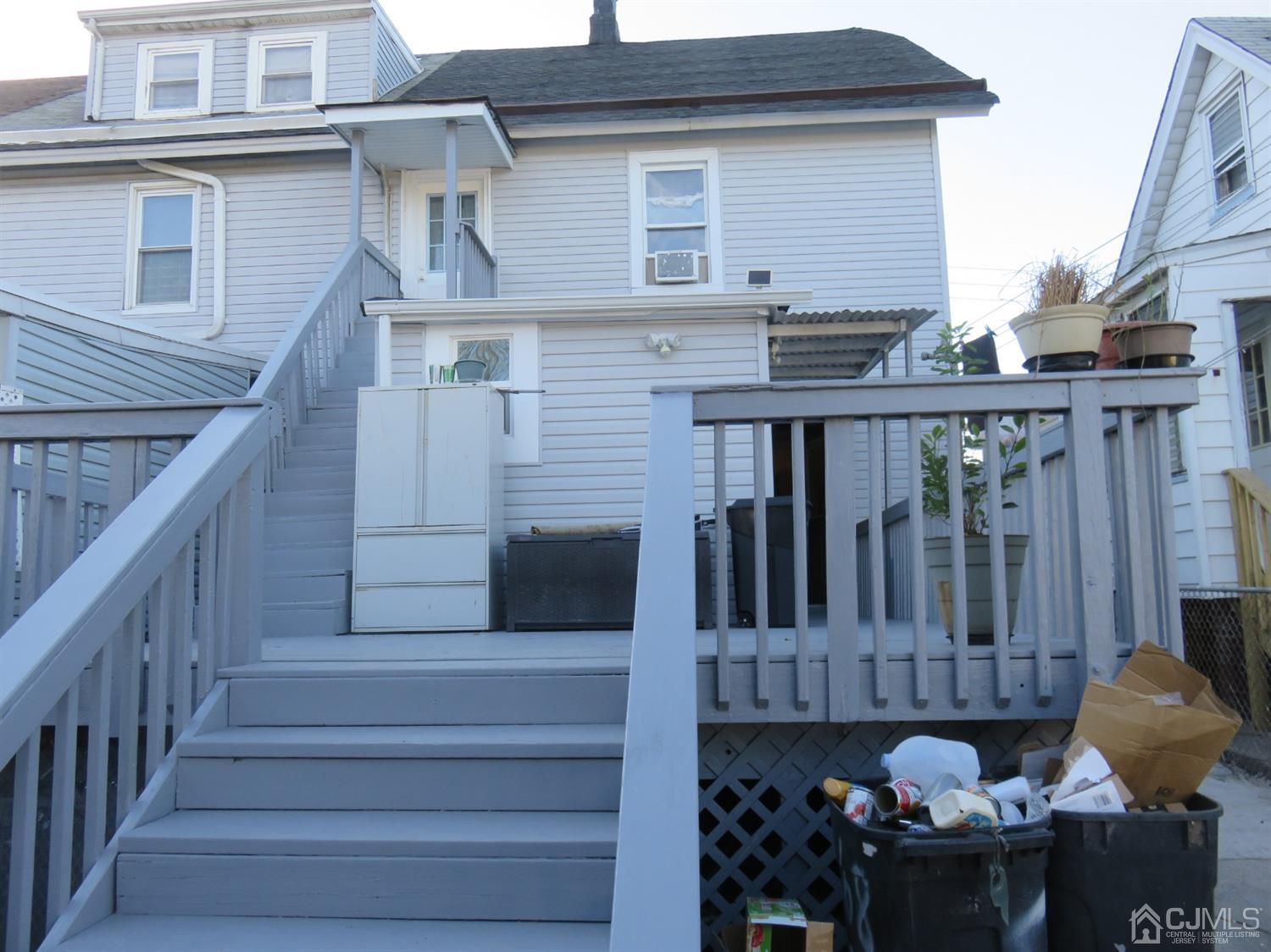 268 Rector Street Perth Amboy, NJ 08861 - Photo 8 of 13 a view of a deck with furniture