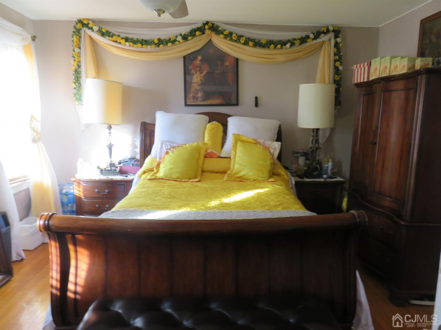 268 Rector Street Perth Amboy, NJ 08861 - Photo 10 of 13 a bedroom with a bed window and a table