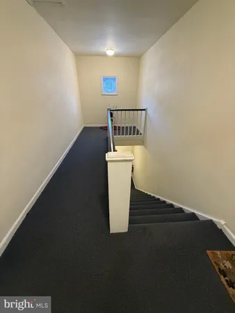 a view of a storage & utility room with a sink