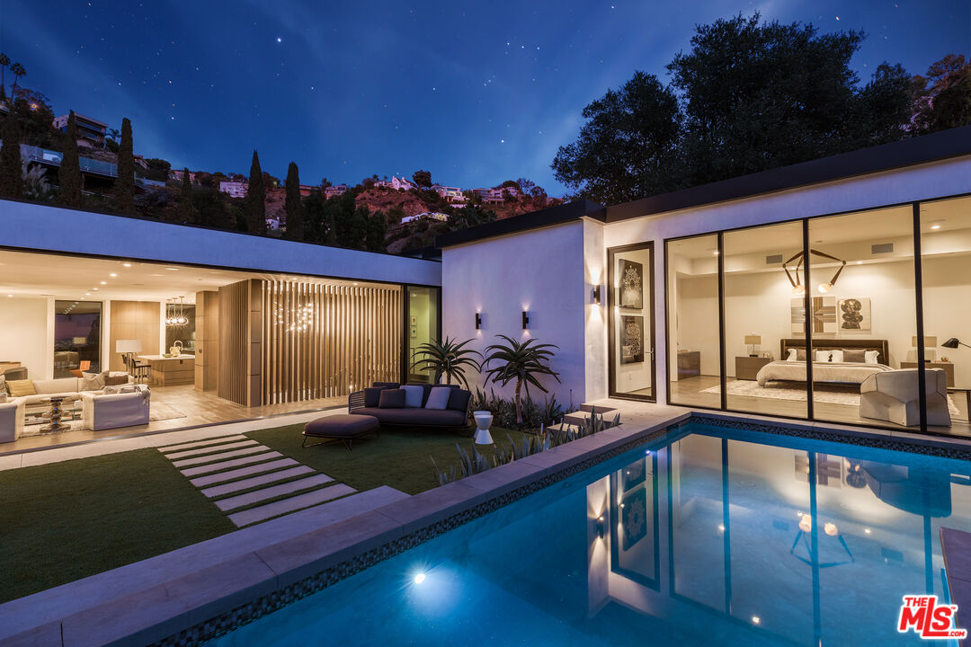 a view of swimming pool with outdoor seating