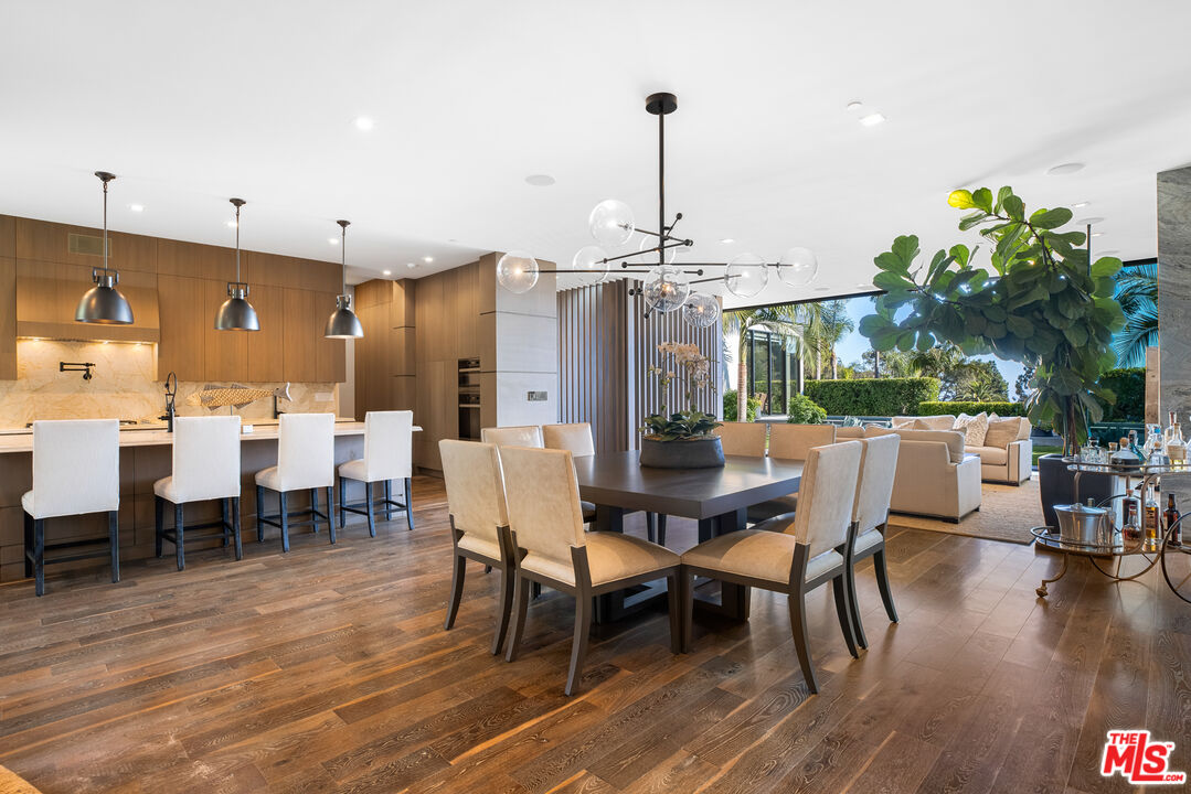 1717 Rising Glen Road Los Angeles, CA 90069 - Photo 17 of 30 a view of a dining room with furniture window and wooden floor