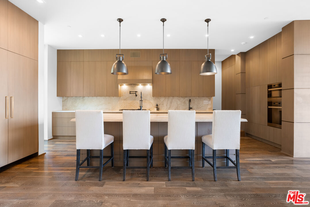 1717 Rising Glen Road Los Angeles, CA 90069 - Photo 18 of 30 a view of a dining room with furniture