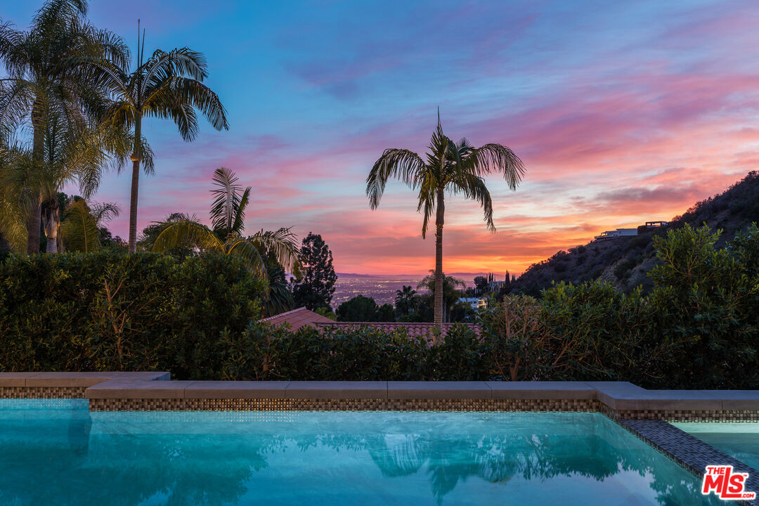 1717 Rising Glen Road Los Angeles, CA 90069 - Photo 2 of 30 a view of a yard and palm trees