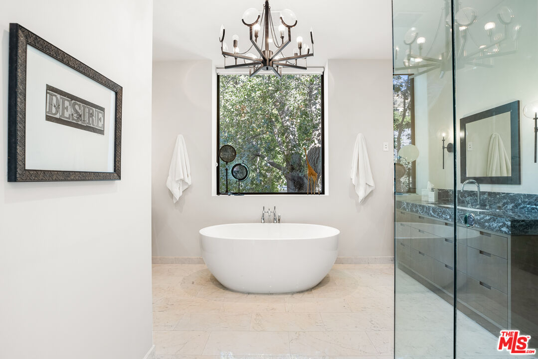 1717 Rising Glen Road Los Angeles, CA 90069 - Photo 21 of 30 a bathroom with a bathtub and a shower