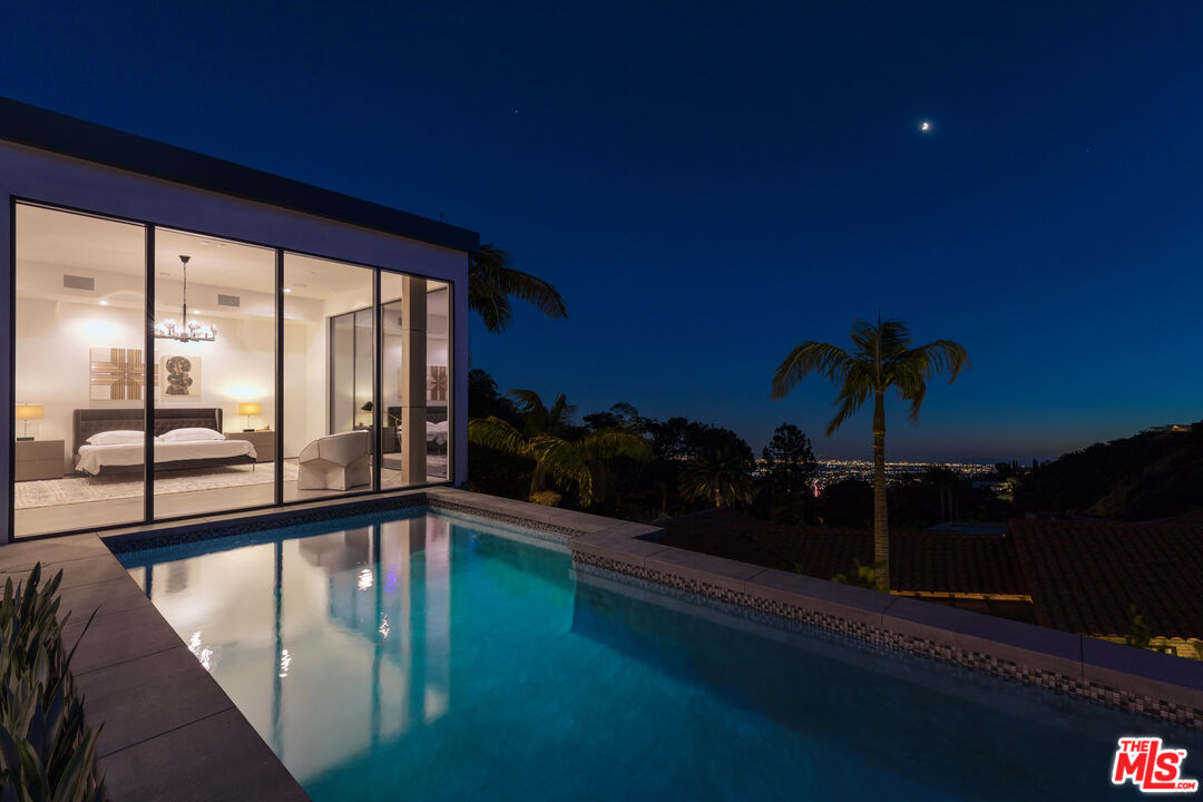 1717 Rising Glen Road Los Angeles, CA 90069 - Photo 3 of 30 a view of swimming pool from a balcony