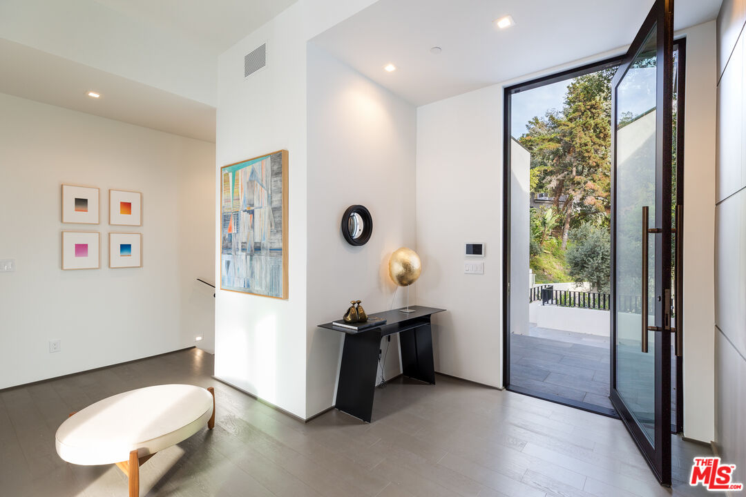 1717 Rising Glen Road Los Angeles, CA 90069 - Photo 7 of 30 a view of kitchen with furniture and a fan