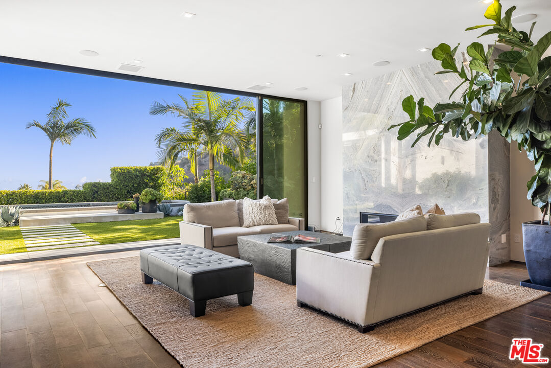 1717 Rising Glen Road Los Angeles, CA 90069 - Photo 8 of 30 a living room with furniture and a large window