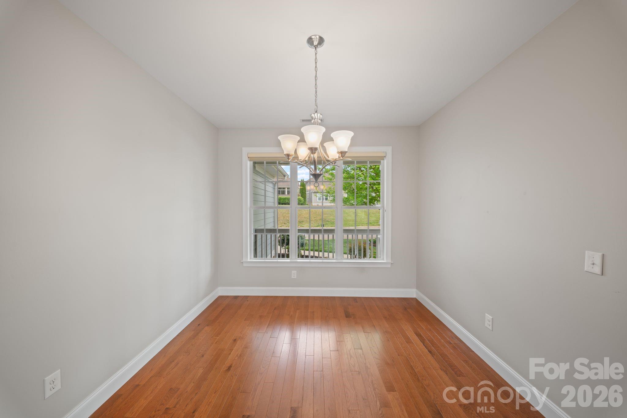 14 Rose Creek Road Leicester, NC 28748 - Photo 13 of 42 a view of a room with window wooden floor and chandelier