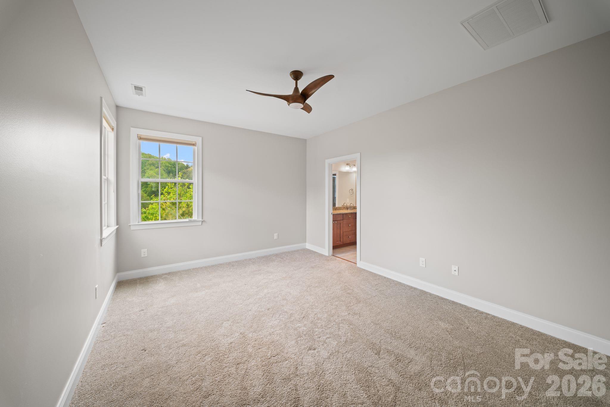 14 Rose Creek Road Leicester, NC 28748 - Photo 17 of 42 an empty room with windows