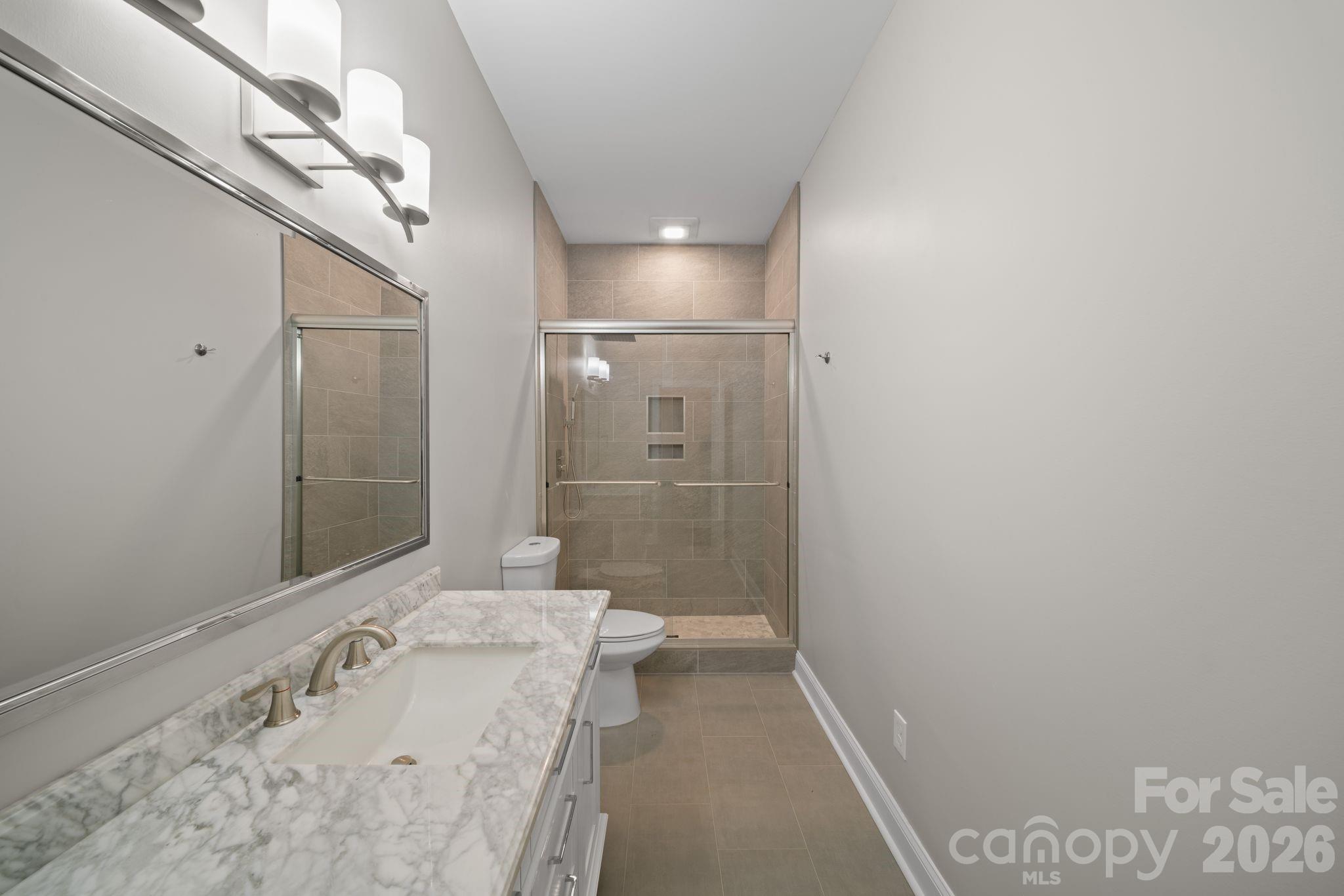 14 Rose Creek Road Leicester, NC 28748 - Photo 29 of 42 a bathroom with a bathtub and shower