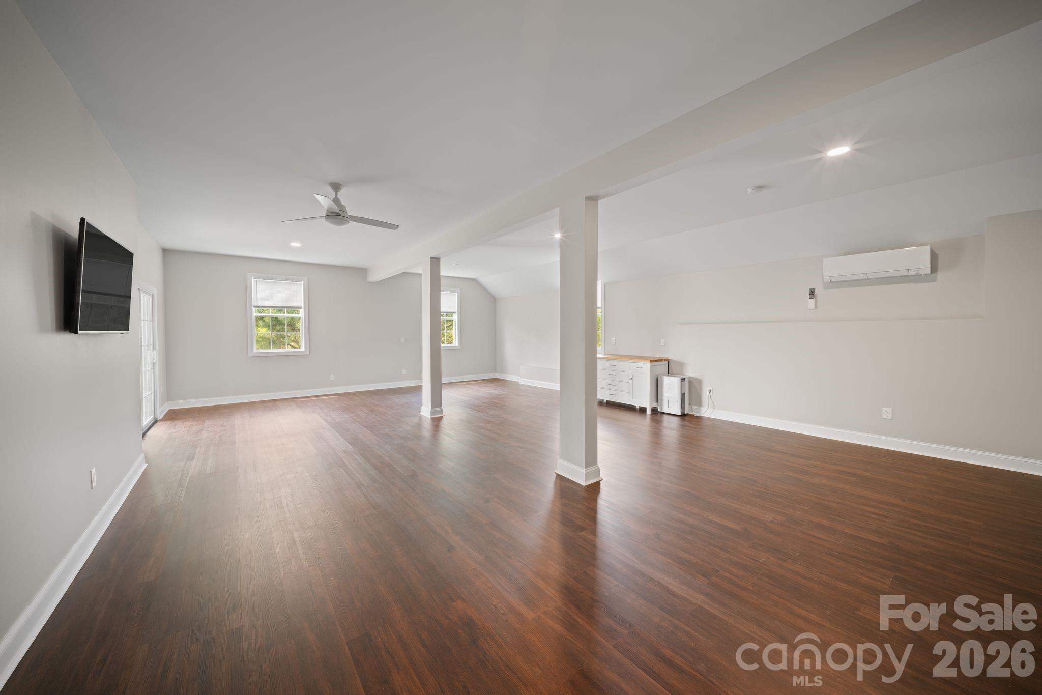 14 Rose Creek Road Leicester, NC 28748 - Photo 32 of 42 a view of a big room with wooden floor and windows