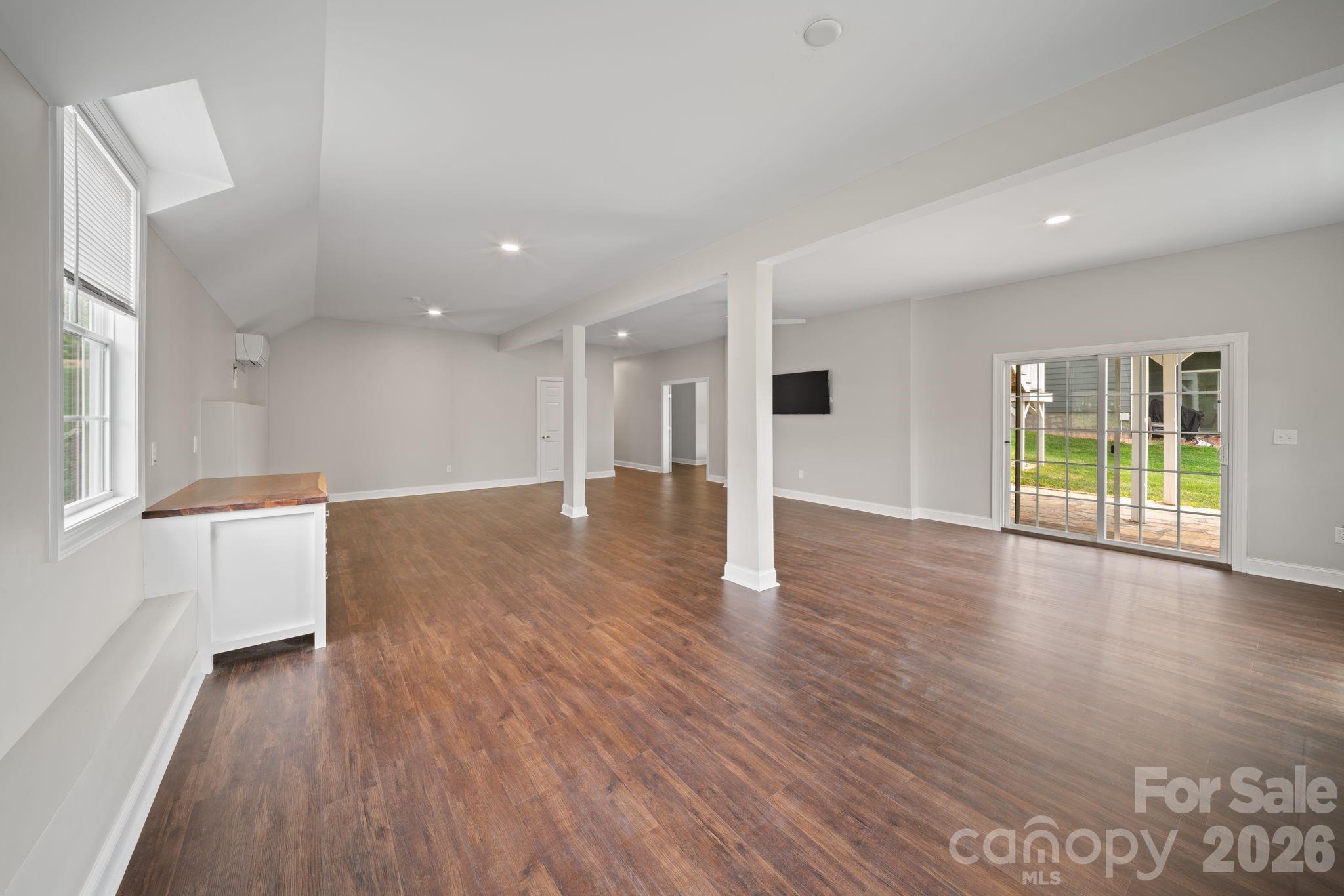 14 Rose Creek Road Leicester, NC 28748 - Photo 33 of 42 a view of a big room with wooden floor and windows