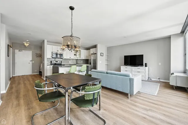 a living room with furniture and a table