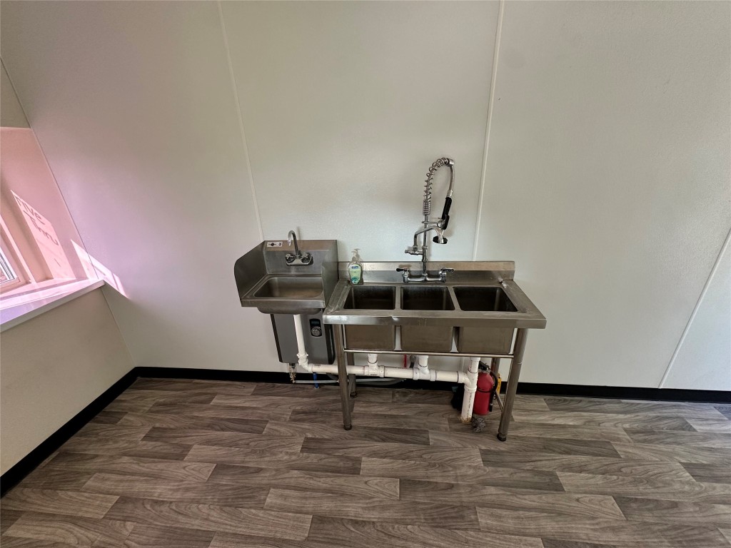 10096 Highway 183 Lockhart, TX 78644 - Photo 12 of 16 a view of a room with wooden floor