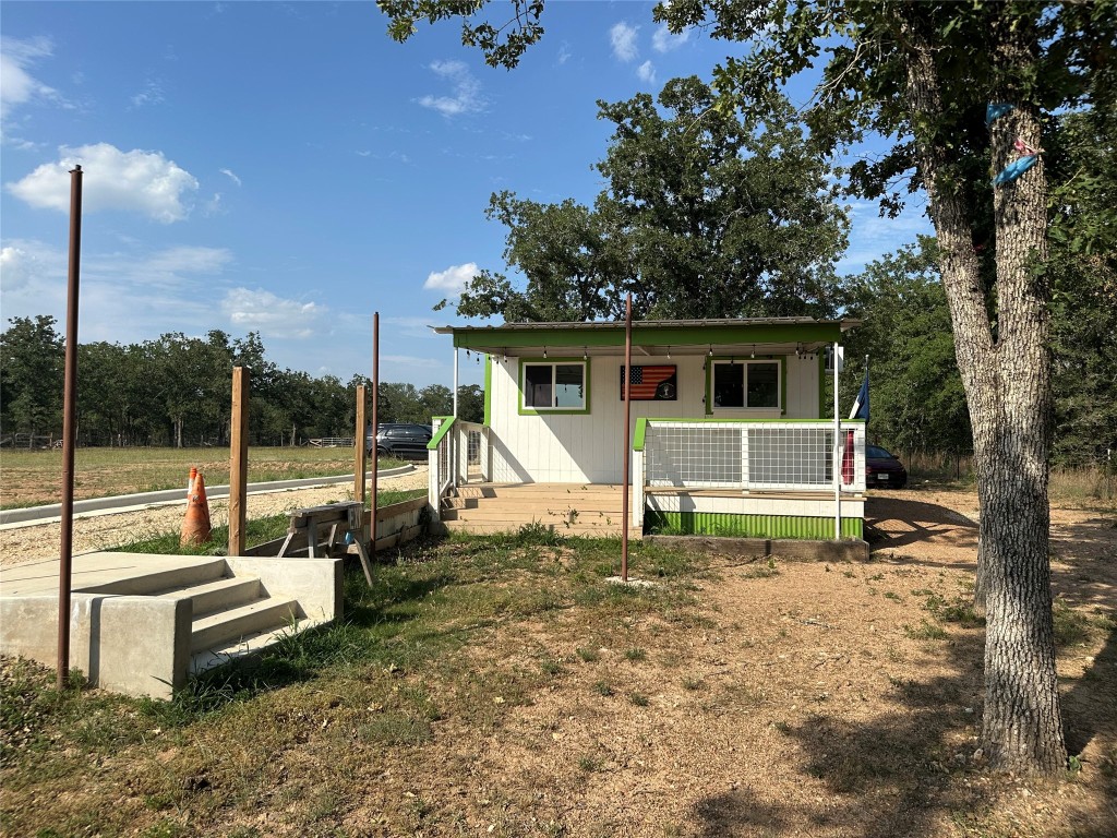 10096 Highway 183 Lockhart, TX 78644 - Photo 9 of 16 a house view with a sitting space and garden