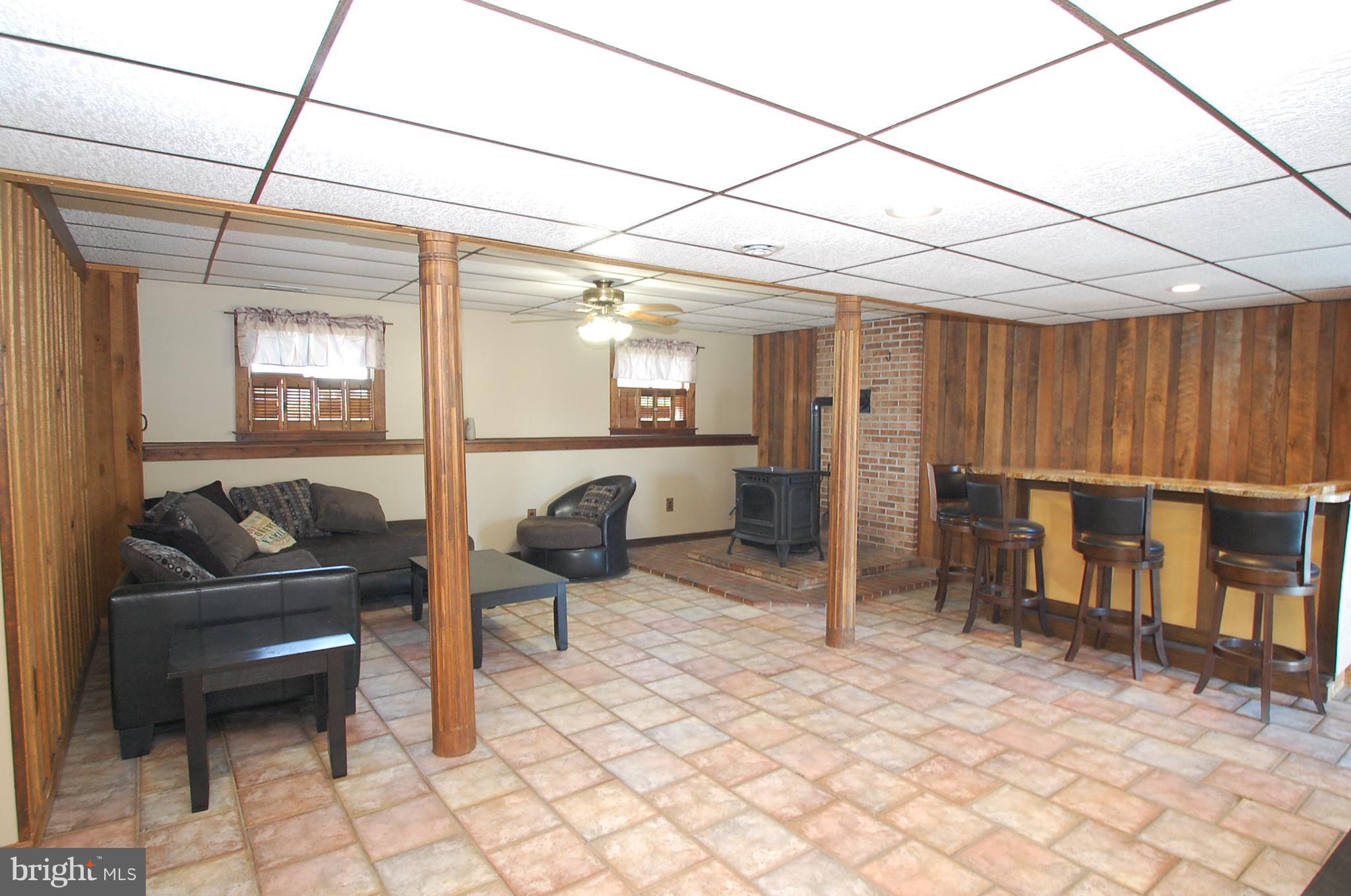 1047 Fowler Road Westminster, MD 21157 - Photo 15 of 20 Family Room with Pellet Stove and Bar