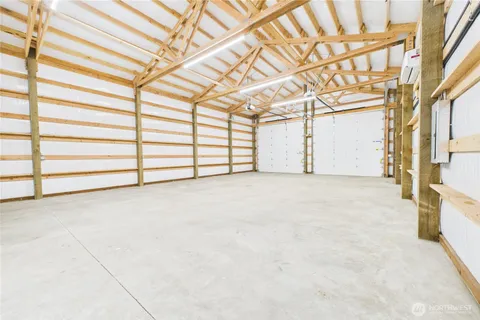 a bathroom with a toilet and a shower curtain