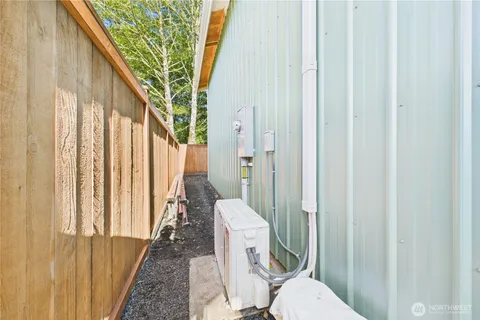 a view of staircase with railing and white walls