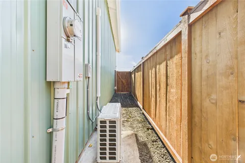 a view of backyard with small cabin