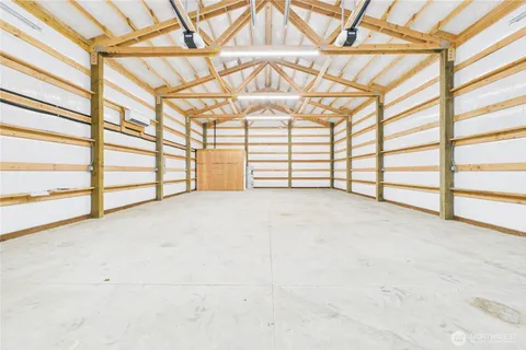 an empty room with a empty space and windows