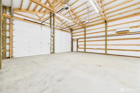 a view of a room with a white bed