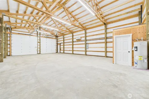a view of a dining room with a table and chairs