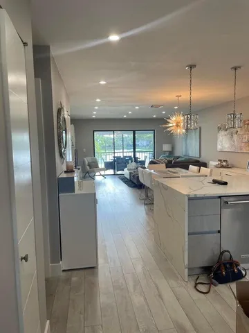 a kitchen with a refrigerator oven a sink and a stove