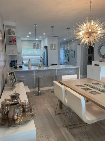 a kitchen with a table and chairs in it