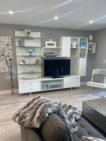 a living room with furniture and a table