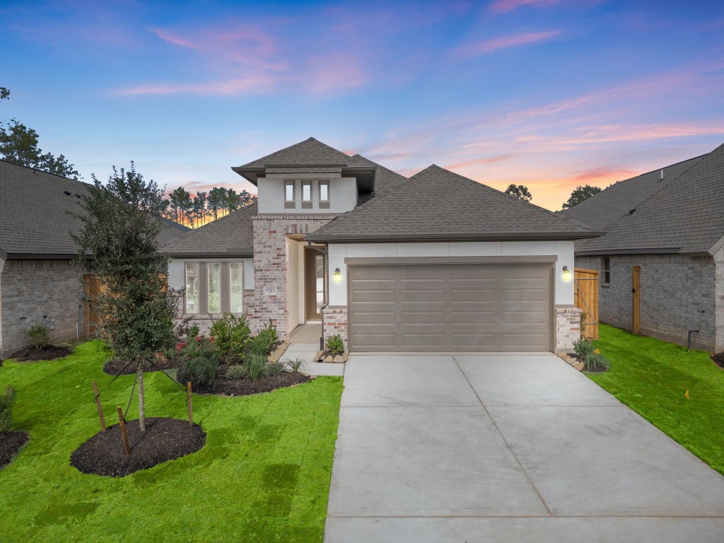 9515 Sierra Crest Lane Porter, TX 77365 - Photo 1 of 38 a front view of a house with a yard and garage