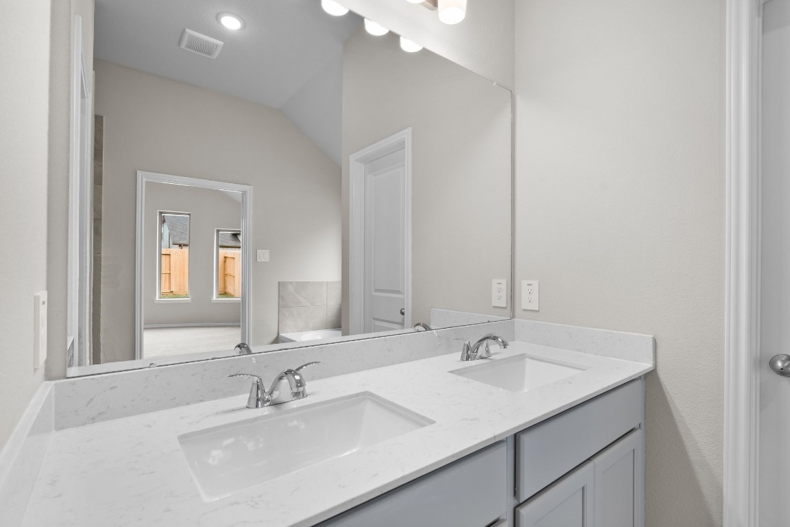 9515 Sierra Crest Lane Porter, TX 77365 - Photo 15 of 38 a bathroom with a sink and a mirror