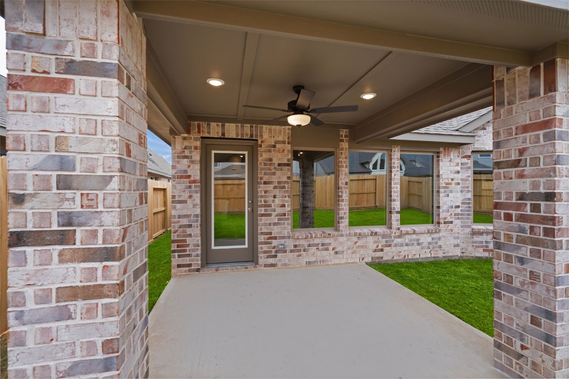 9515 Sierra Crest Lane Porter, TX 77365 - Photo 22 of 38 a view of a brick house with a yard and porch