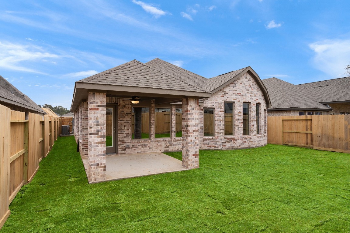 9515 Sierra Crest Lane Porter, TX 77365 - Photo 23 of 38 a view of a house with a yard and porch