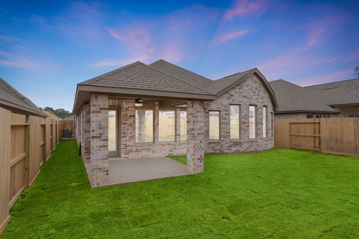 9515 Sierra Crest Lane Porter, TX 77365 - Photo 24 of 38 a view of a house with a yard and pathway