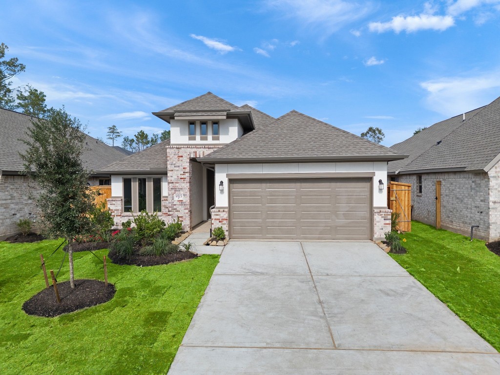 9515 Sierra Crest Lane Porter, TX 77365 - Photo 25 of 38 a front view of a house with a garden