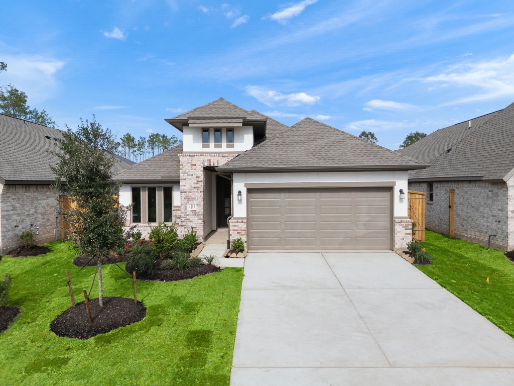 9515 Sierra Crest Lane Porter, TX 77365 - Photo 26 of 38 a front view of a house with a garden