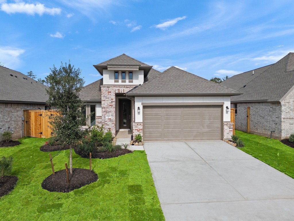 9515 Sierra Crest Lane Porter, TX 77365 - Photo 27 of 38 a front view of a house with a garden