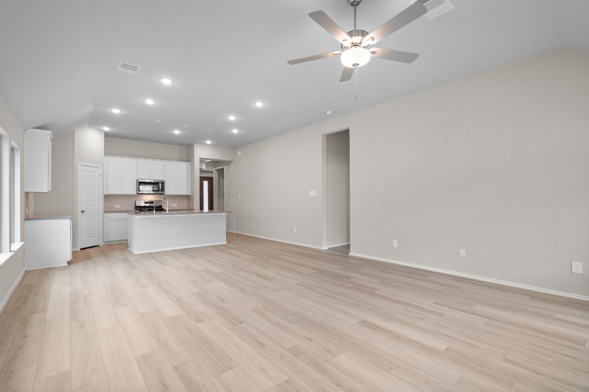 9515 Sierra Crest Lane Porter, TX 77365 - Photo 7 of 38 a view of a kitchen with a sink and a refrigerator