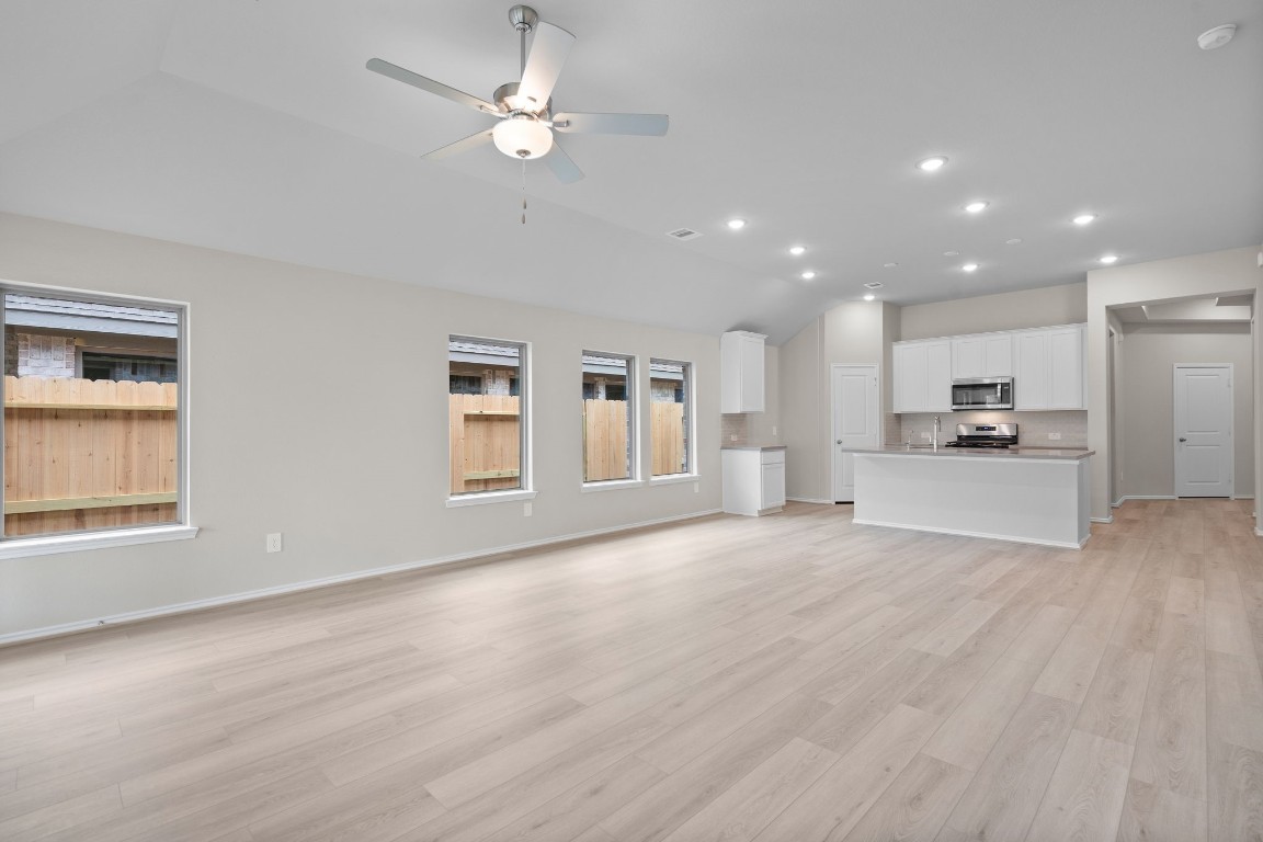 9515 Sierra Crest Lane Porter, TX 77365 - Photo 8 of 38 a view of an empty room with kitchen and window