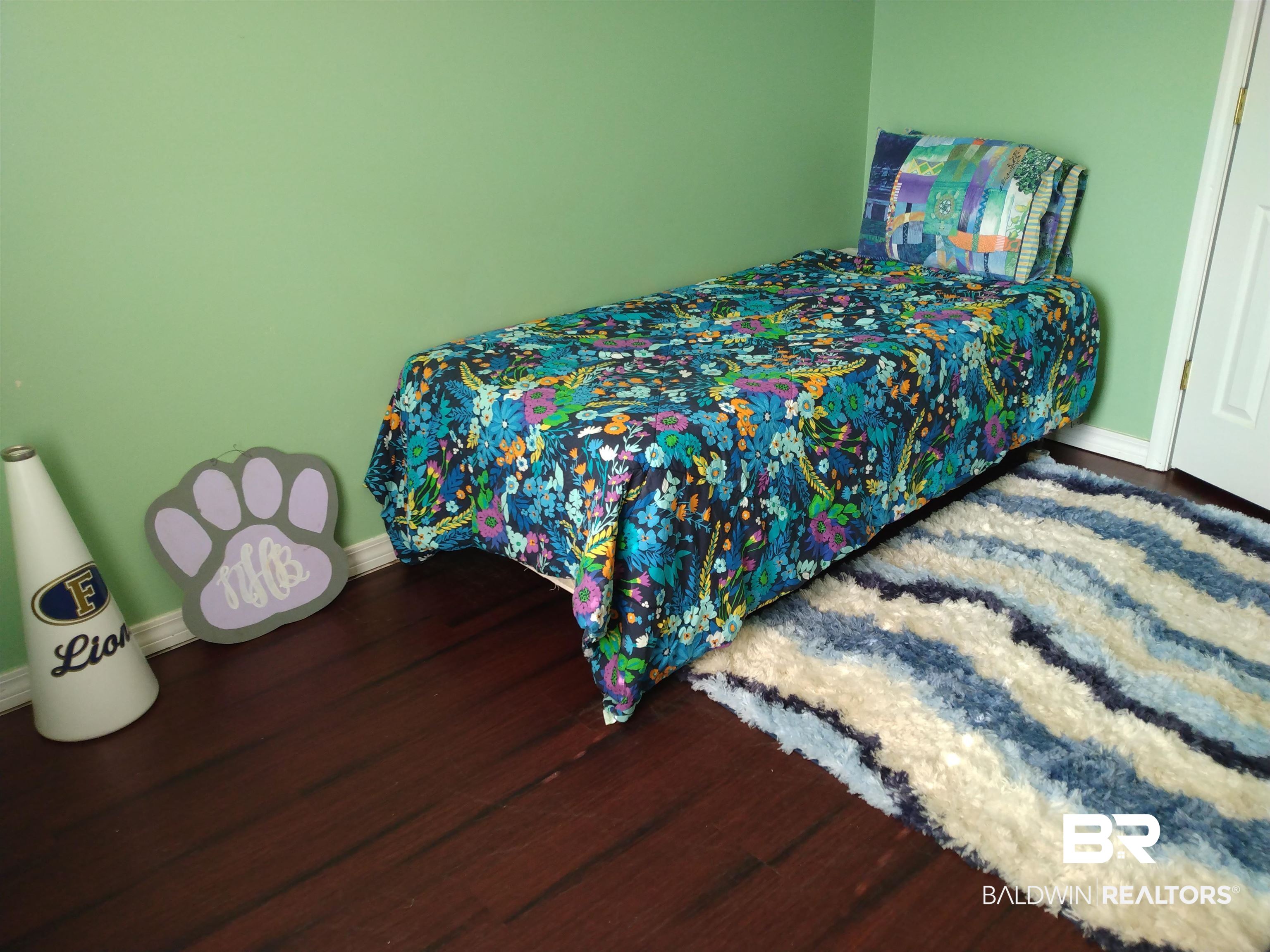 431 Hamilton Boulevard Foley, AL 36535 - Photo 19 of 30 Guest bedroom featuring dark wood-type flooring.