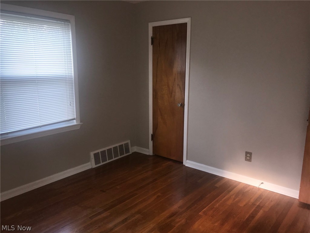 1403 Lorimer Road Cleveland, OH 44134 - Photo 10 of 28 Bedroom #1 features beautiful hardwood floors