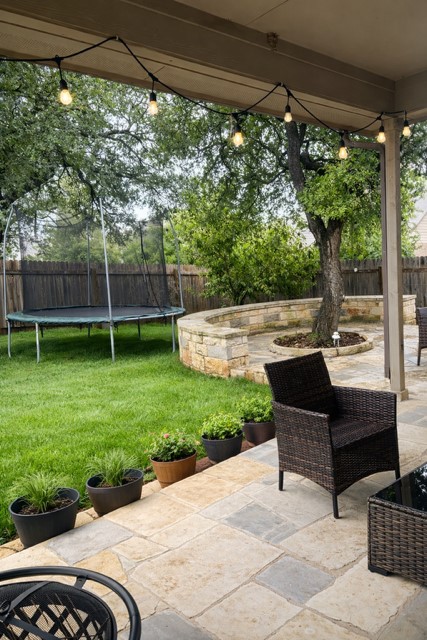 11613 Reading Court Austin, TX 78717 - Photo 15 of 16 a backyard of a house with yard table and chairs