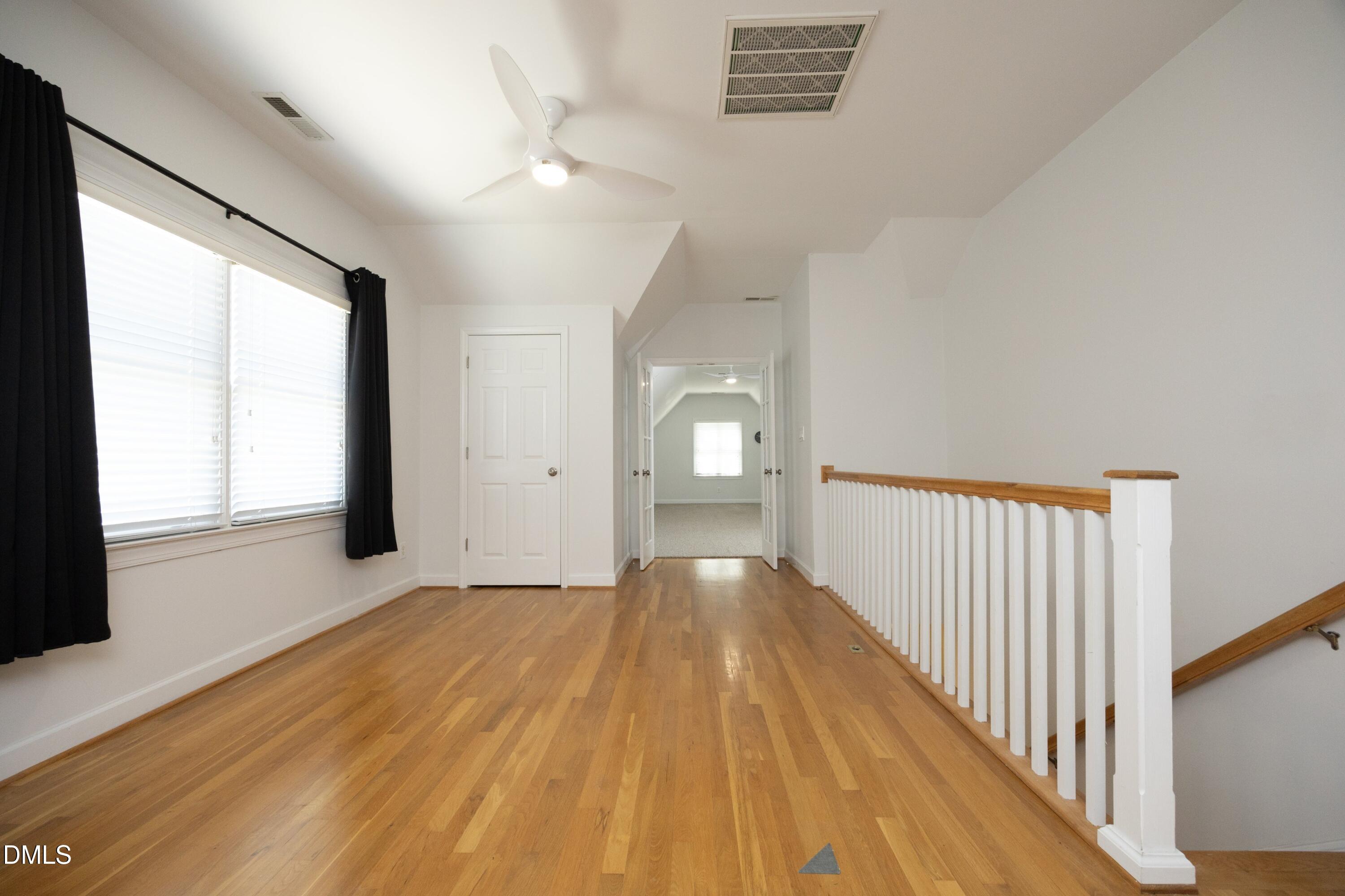 1427 Moosecreek Drive Raleigh, NC 27614 - Photo 28 of 51 a view of a room with wooden floor and window