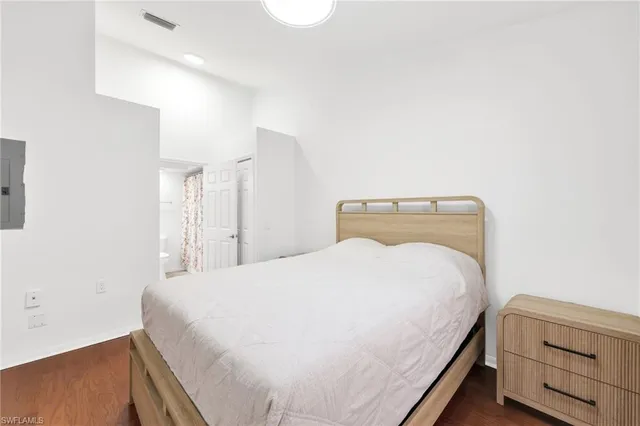 a bedroom with a bed and a dresser