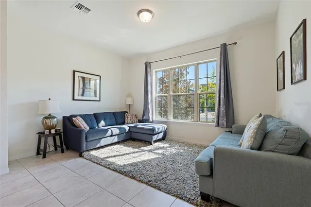 a living room with furniture and a window