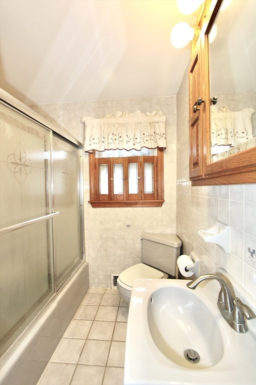 6 Roald Street Worcester, MA 01605 - Photo 7 of 11 a bathroom with a sink and a mirror