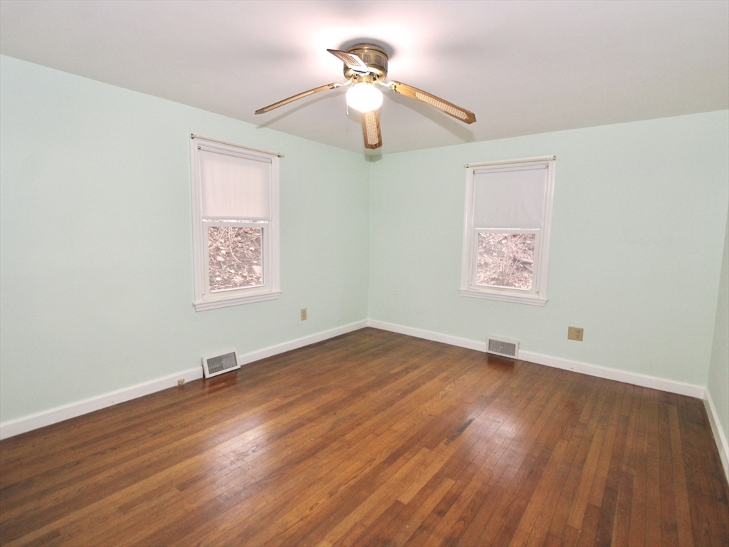 6 Roald Street Worcester, MA 01605 - Photo 8 of 11 a view of a room with wooden floor chandelier and a ceiling fan