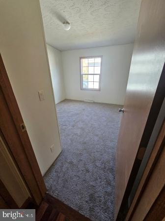 2110 Mays Landing Road, Unit WALL Millville, NJ 08332 - Photo 16 of 18 a view of an empty room and window