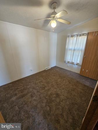 2110 Mays Landing Road, Unit WALL Millville, NJ 08332 - Photo 18 of 18 an empty room with windows and fan