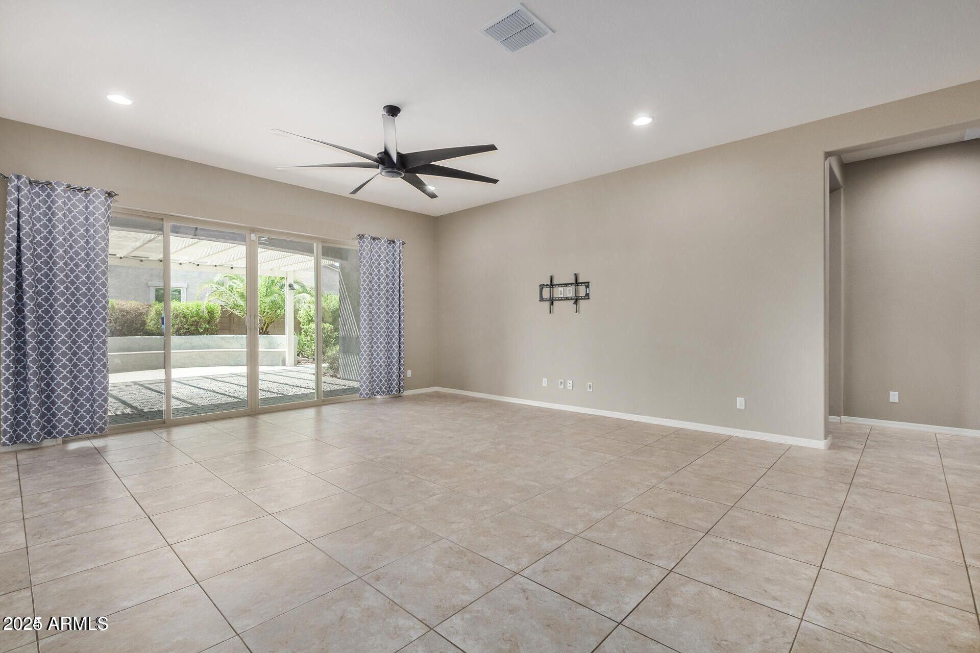 15430 South 183rd Lane Goodyear, AZ 85338 - Photo 11 of 66 a view of an empty room with a window